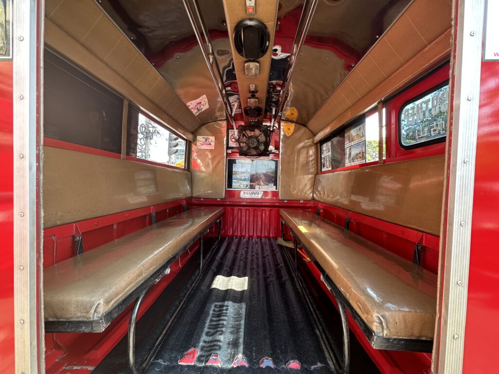 interior of red Songthaew truck in Thailand 