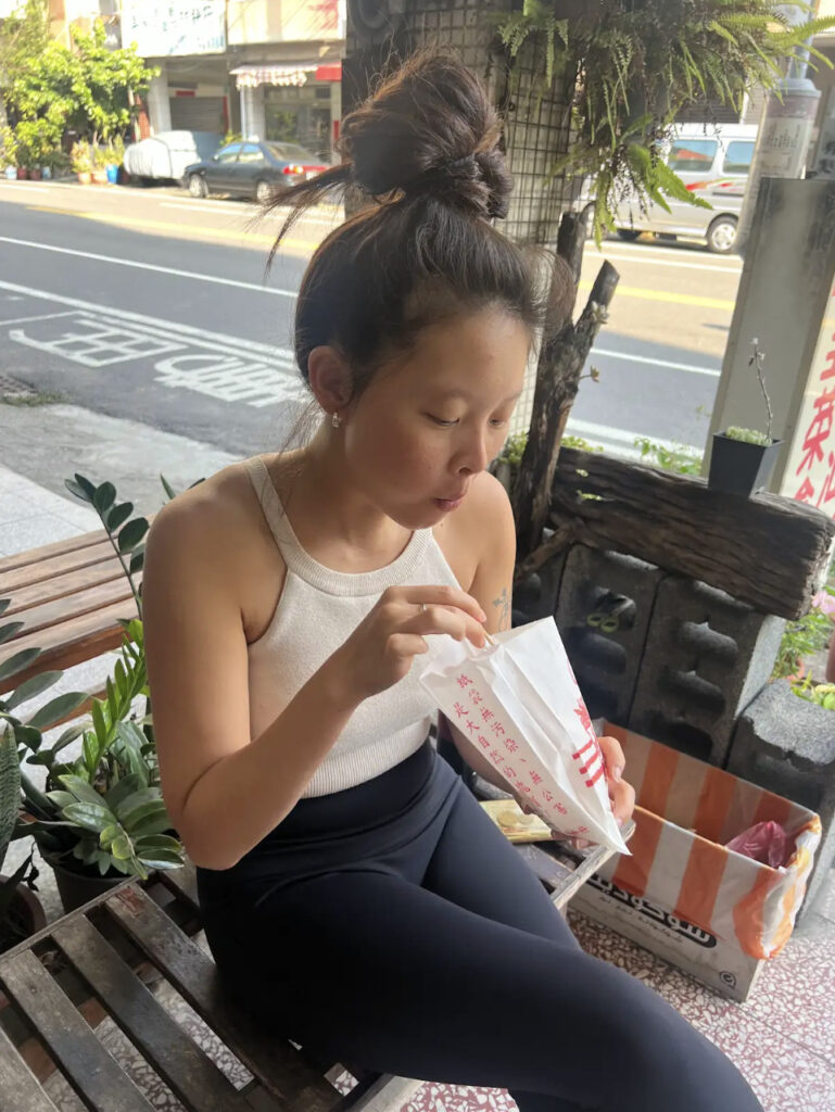 Our friend and tour guide, Debbie, eating street food.