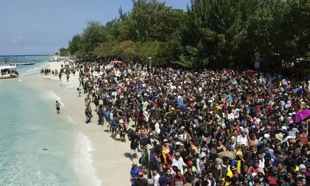 Tourists on an Indonesian island waiting to be evacuated after the 2018 quake.