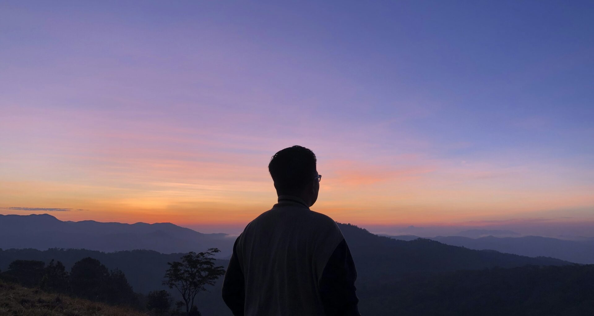 man standing on cliff
