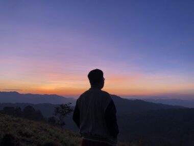 man standing on cliff